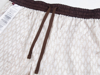 PANTALONES CORTOS GUCÇI