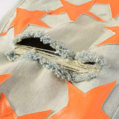 Jeans Amr con toppa a stella arancione