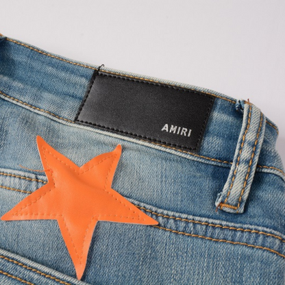 Jeans Amr con toppa a stella arancione