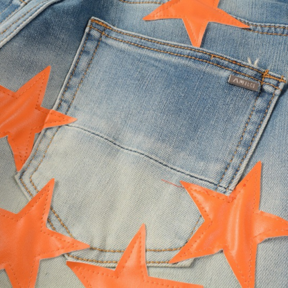 Jeans Amr con toppa a stella arancione