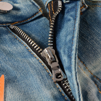 Jeans Amr con toppa a stella arancione