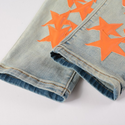 Jeans Amr con toppa a stella arancione