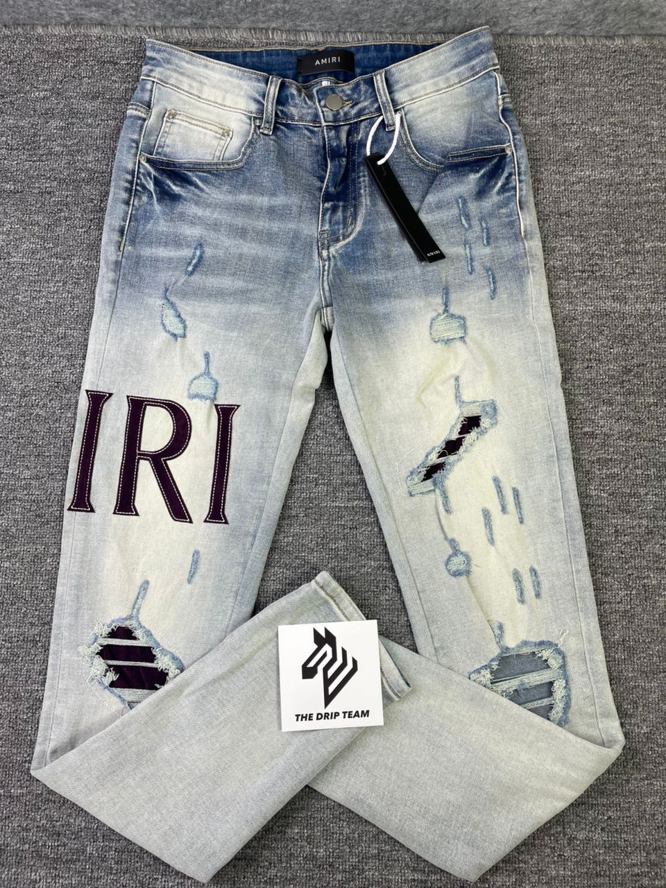 Jeans strappati con logo Amr